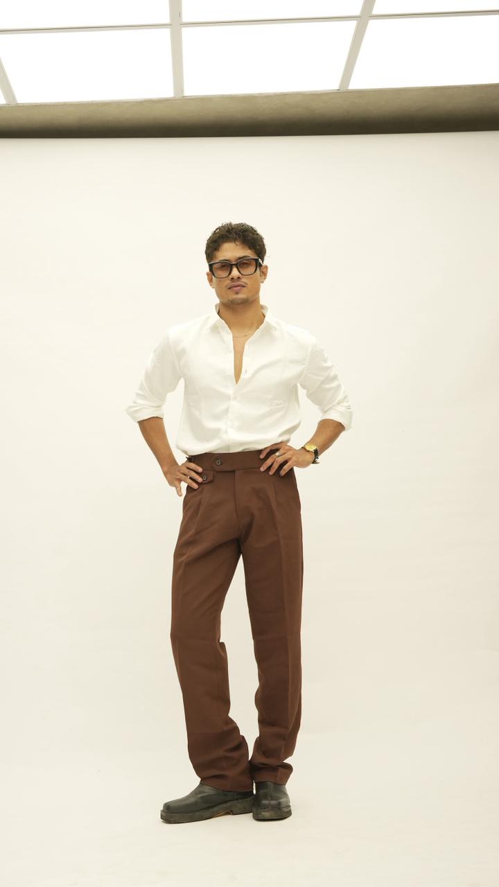 White shirt with brown tailored trousers, full length